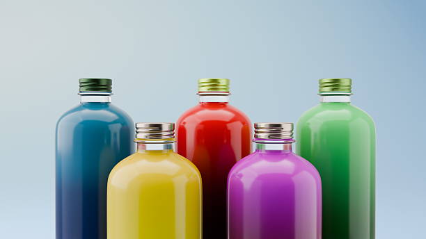 istock Five bottles filled with bright, colorful drinks stand together against a soft backdrop. Each bottle showcases a distinct hue, from deep blue to bright yellow. 3d render 2248987890
