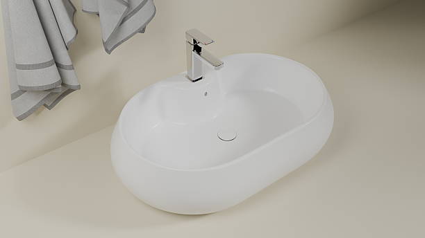 istock sleek oval sink features a shiny modern faucet set against a soft neutral backdrop. Fresh towels hang nearby, adding to the contemporary bathroom design. 3d render 2248987906
