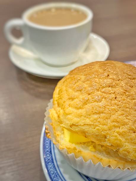 Close-up of a set Hong Kong Polo Bun with Butter and famous silky milk tea