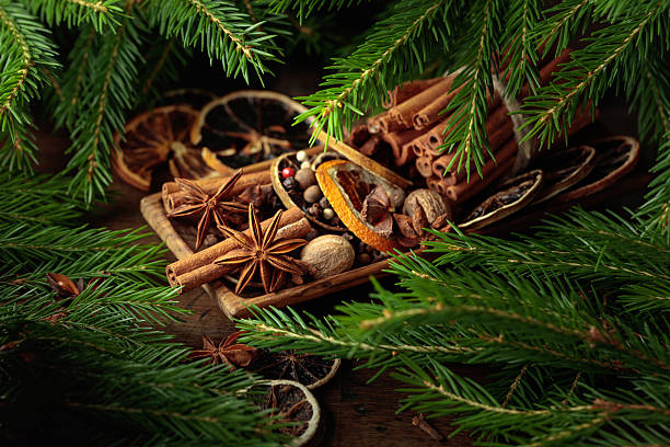 istock Spices and branches of Christmas tree on an old wooden table. 2248990314