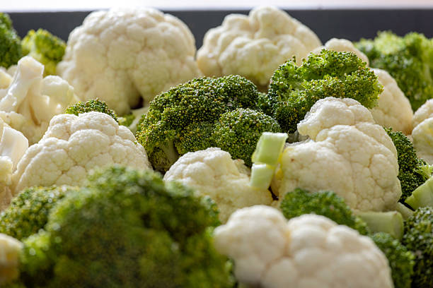 cauliflower and broccoli are ready to cook on the tray