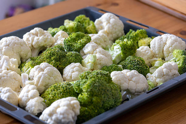 cauliflower and broccoli are ready to cook on the tray