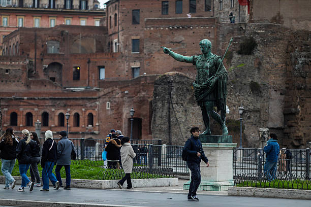 Rome, Italy – October 01, 2019: statue of Emperor Julius Caesar in Rome, ancient architecture of the city of Rome. Historical sights of Rome.