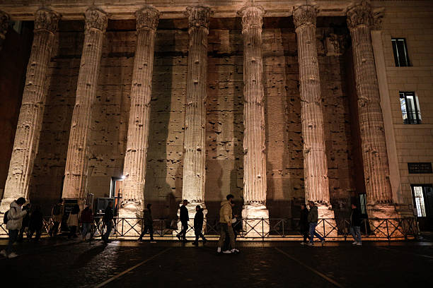 Rome, Italy - January 10, 2024: Temple of Hadrian (Hadrianeum) at night in Rome.