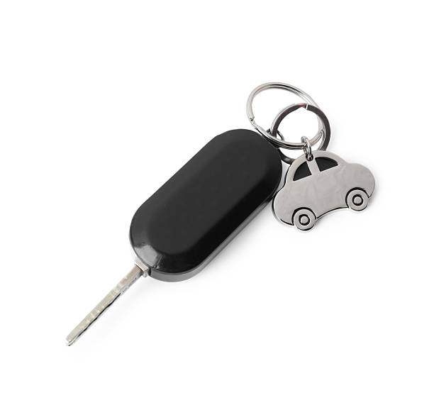 istock Car key with keychain isolated on white, top view. Buying auto 2248992961