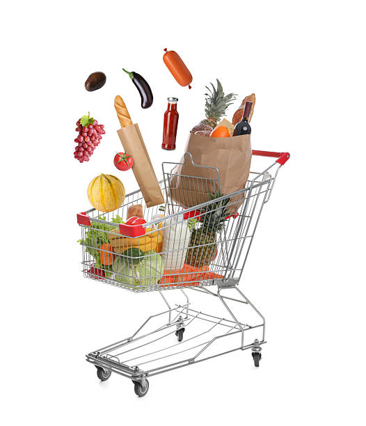 istock Groceries falling into shopping cart on white background 2248994125