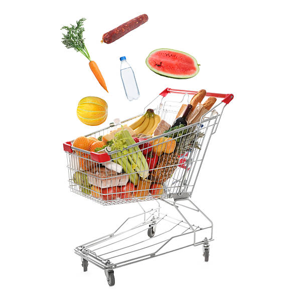 istock Groceries falling into shopping cart on white background 2248994129