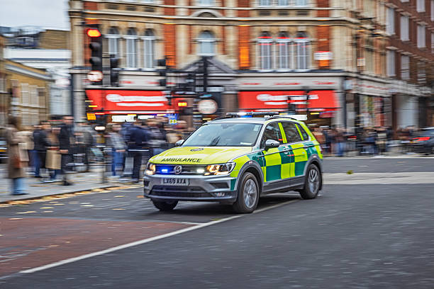 Chinatown, London, England, United Kingdom ,Europe - November 16th 2025: An ambulance rushing through the streets of London’s classic Chinatown during an emergency response. The central district has transformed in recent years from a rough past into a fashionable area with popular restaurants and is now fully integrated into modern London, while retaining its distinctive cultural character.