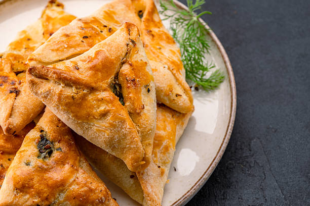 istock Homemade triangular pastry with spinach and cheese. A traditional Middle Eastern dish. 2249003301