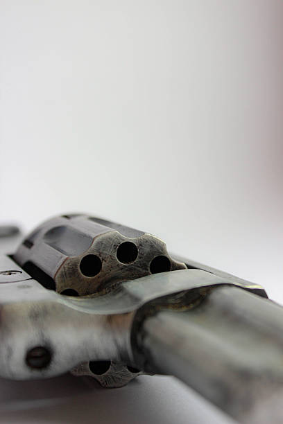 istock macro of a revolvers cylinder and frame with dramatic blur. Concept for danger, criminal investigation, or weapon mechanics. 2249004558