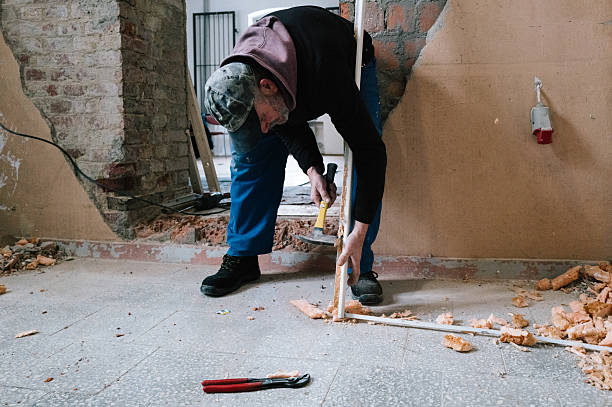 istock bricklayer install a new door in an existing wall 2249007402