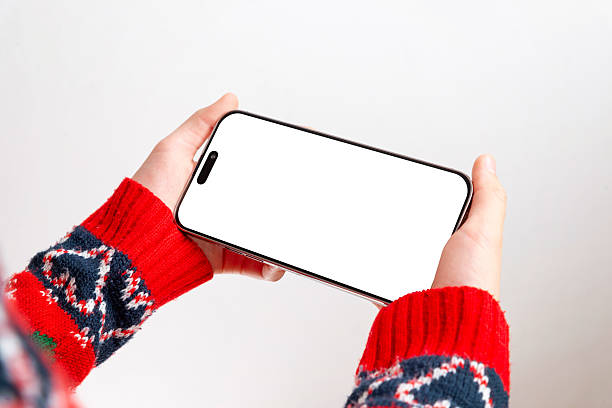 Blank horizontal phone screen mockup with festive sweater sleeves, ideal for app previews, design templates, UI concepts and winter-themed marketing visuals