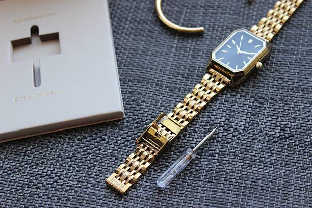 istock Gold Watch with Bracelet and Tool Set on Neutral Background 2249008486