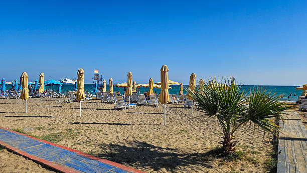 istock Sunny Beach Loungers Under Blue Skies 2249011310