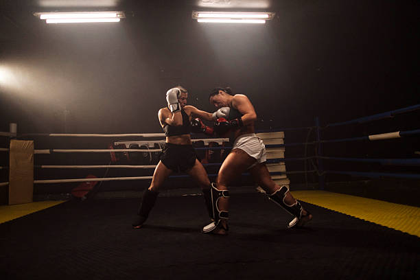 istock Two female boxers sparring in a boxing ring 2249016985