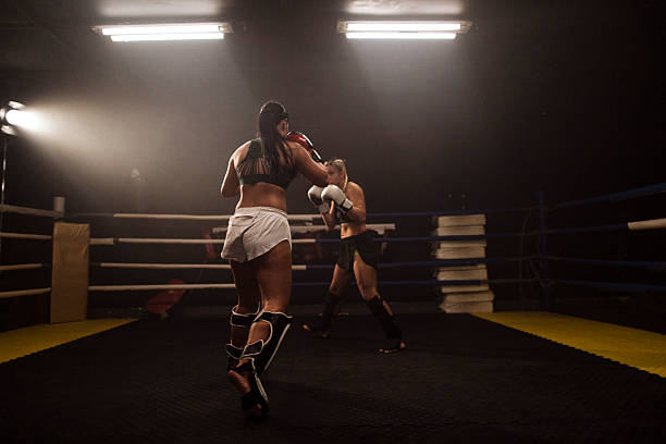 istock Female boxer in a match inside a boxing ring 2249016987