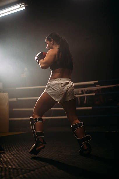 istock Female boxer in the ring training with gloves 2249017959