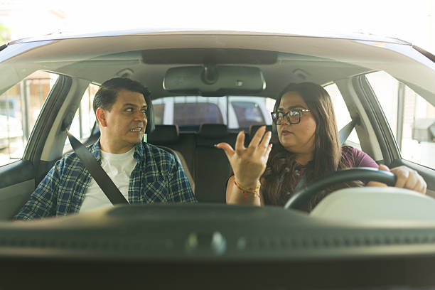 istock Couple arguing inside car while driving, experiencing relationship conflict, stress, anger, and tension during a dispute 2249019081