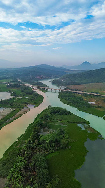 istock Drone View of Turquoise Blue River with Mountain Background 2249019910