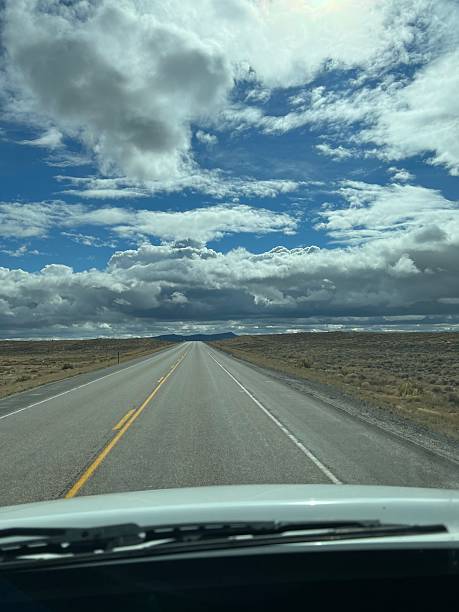 istock Endless Road Stretches Through Dramatic Skies in a Remote Landscape, Inviting Adventure and Exploration 2249026407
