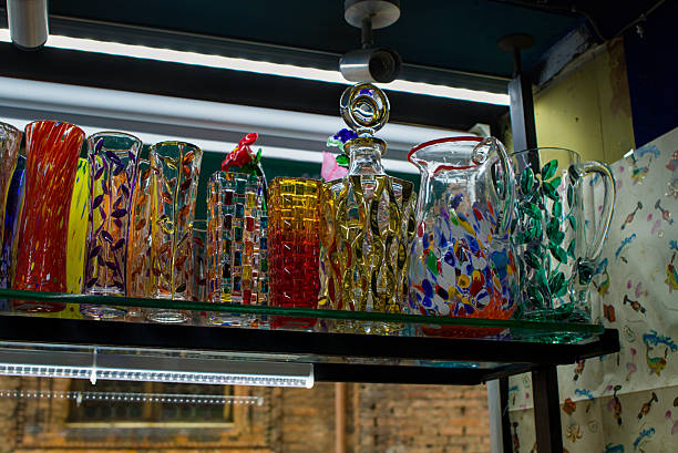 istock Colorful glass vessels glow under soft lights. Patterns swirl across each handcrafted form. 2249026787