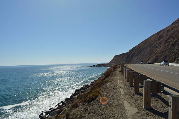 istock Scenic Coastal View With Glistening Water and Rugged Cliffs Along the Highway 2249031136