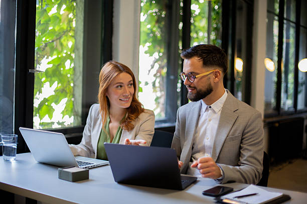 istock Business colleagues collaborating on laptop in modern office 2249031575