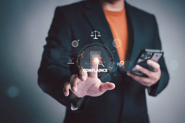 istock Businessman touching virtual compliance icon with digital interface. Concept for corporate governance, law regulation, risk management, and legal compliance in modern business technology. 2249033494