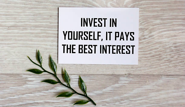 istock Invest in yourself, it pays the best interest - text written in a notebook. 2249034463