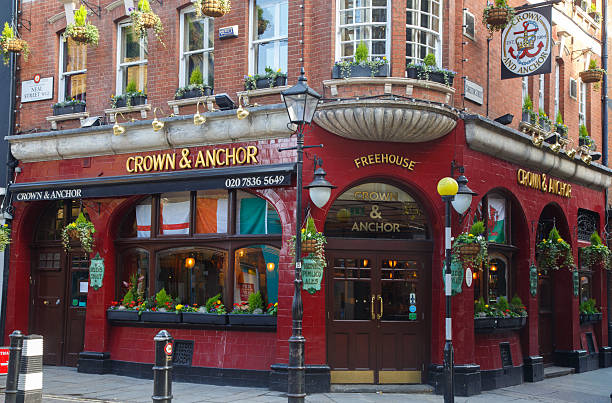 The famous Crown and Anchor pub historic brick building facade on a corner of Covent Garden, city of London, England.