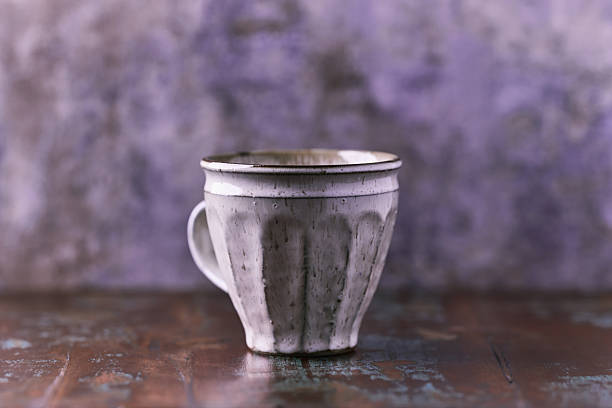 Handcrafted pottery mugs with rustic design and textured glaze