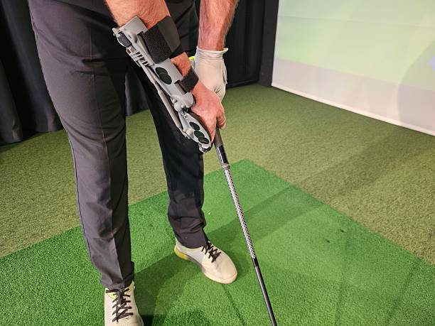 istock Innovative golf swing training aid used by golfer in indoor studio for skill improvement and practice concept 2249044186