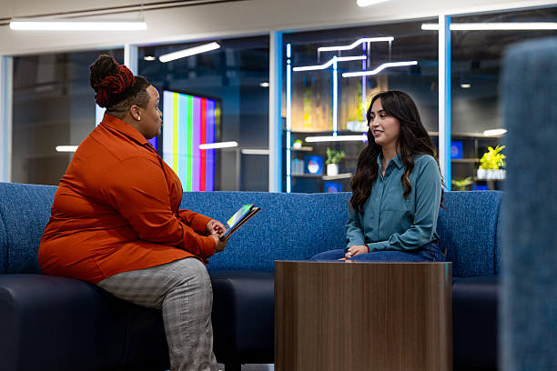 istock Diverse Female Co-workers Meet to Discuss Project 2249047762
