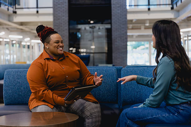 istock Diverse Female Co-workers Meet to Discuss Project 2249047785