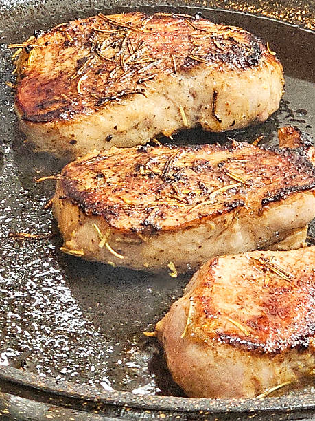 istock Frying pork tenderloin steaks 2249054078