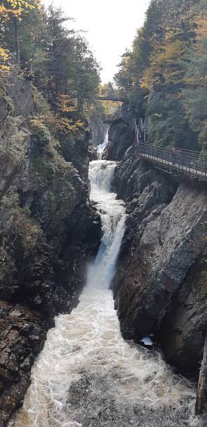 istock Dramatic Canyon Waterfall and Tourist Trails in Autumn 2249058968