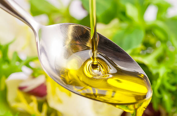 istock A splash of olive oil on a spoon 2249059554