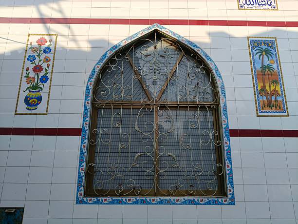 istock Beautiful Islamic window design on mosque exterior displaying symmetrical patterns, cultural craftsmanship, and serene outdoor architecture 2249059613