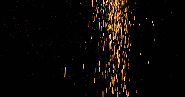 istock Abstract particles of gold dust float in the air 2249062176