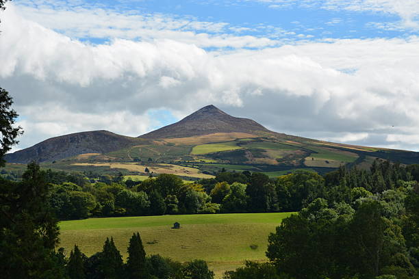 istock Majestic Hills Rise Under a Bright Sky in an Idyllic Countryside Setting During the Day 2249066022