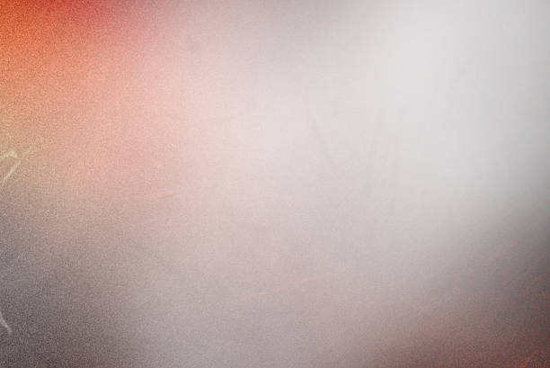 istock Red and grey light leak overlay with soft gradient fade, subtle dust scratches, and fine grain texture. Retro film-style abstract background ideal for adding vintage atmosphere, cinematic glow, or creative light effects to photos and designs. 2249073762