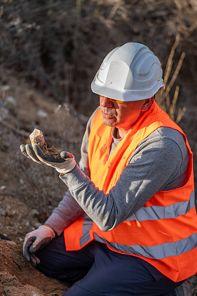 istock Geologist inspecting a mine,Explorers collect soil samples in search of minerals. 2249077359