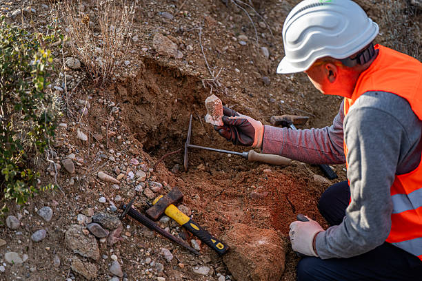 istock Geologist inspecting a mine,Explorers collect soil samples in search of minerals. 2249077368