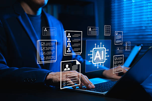 istock Businessman using AI-powered software on laptop for automated resume screening and candidate selection. Concept of artificial intelligence in HR tech, AI recruitment analytics and digital hiring. 2249077406
