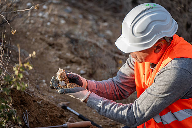 istock Geologist inspecting a mine,Explorers collect soil samples in search of minerals. 2249077480