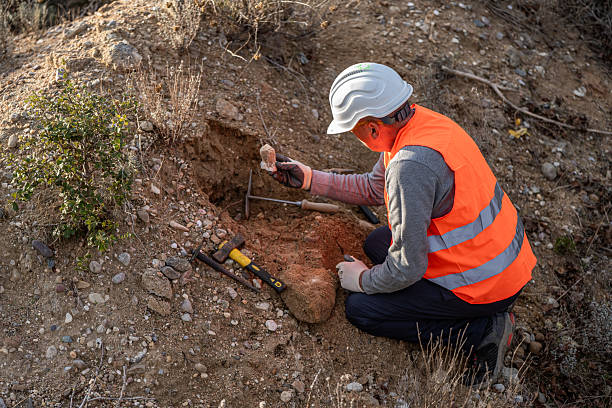 istock Geologist inspecting a mine,Explorers collect soil samples in search of minerals. 2249077544
