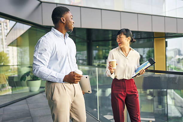 istock Diverse business people discussing during coffee break outside office 2249078333