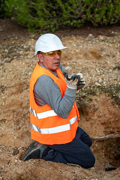 istock Geologist inspecting a mine,Explorers collect soil samples in search of minerals. 2249079384