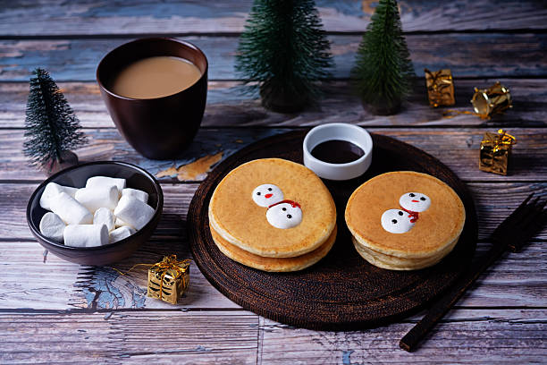 istock Pancakes with marshmallow snowmen in a plate for Christmas holidays 2249079608