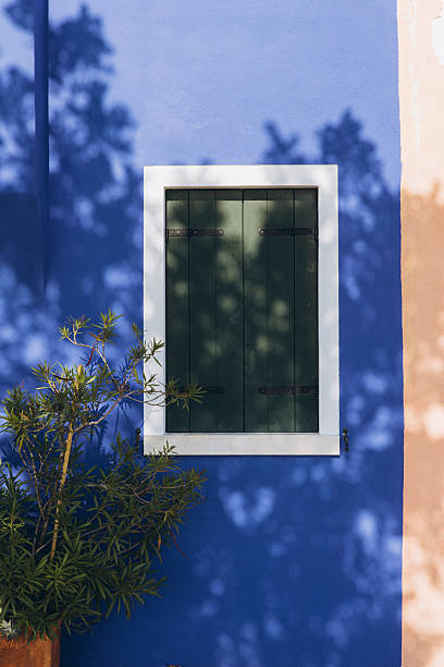 istock Burano house blue wall window shutters 2249082350